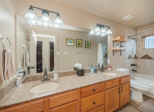 full bathroom with vanity, shower / bath combination with curtain, and toilet