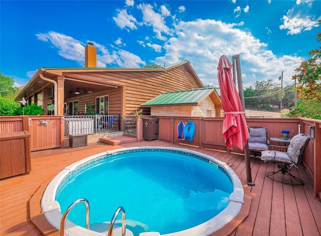 view of pool featuring a wooden deck