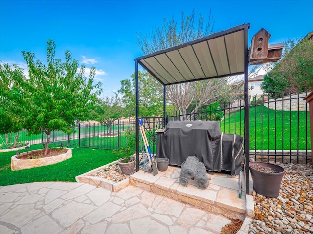 view of patio with a grill