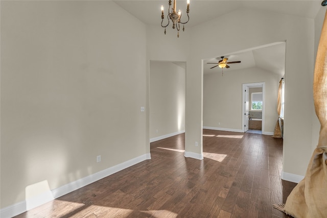 interior space featuring dark hardwood / wood-style floors, lofted ceiling, and ceiling fan with notable chandelier