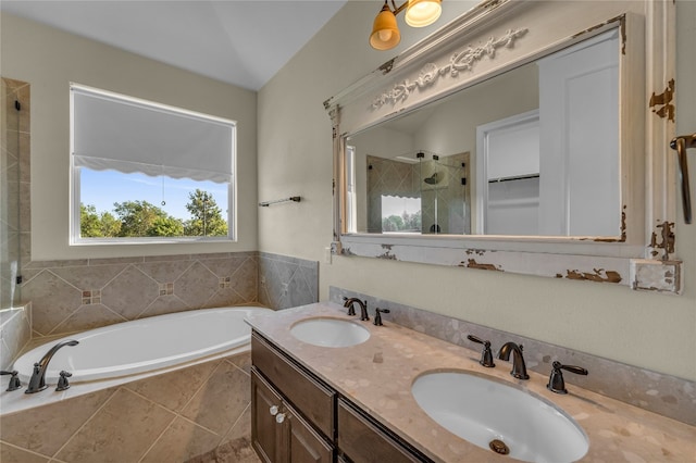 bathroom featuring vanity and shower with separate bathtub