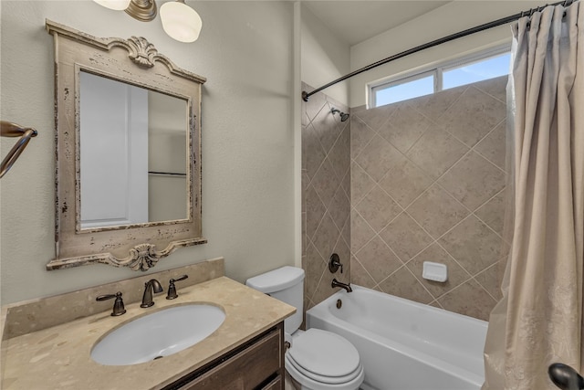 full bathroom featuring vanity, shower / bath combination with curtain, and toilet