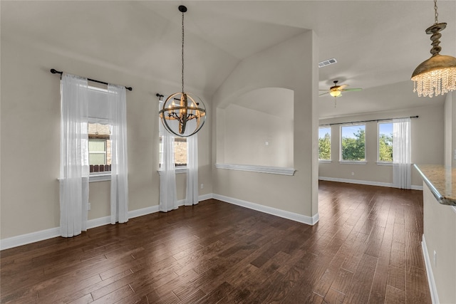 unfurnished dining area featuring dark hardwood / wood-style flooring, lofted ceiling, and a wealth of natural light