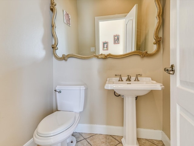 bathroom with tile patterned floors and toilet