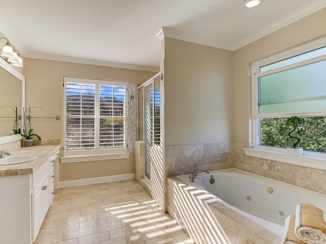 bathroom featuring tiled bath, crown molding, and vanity