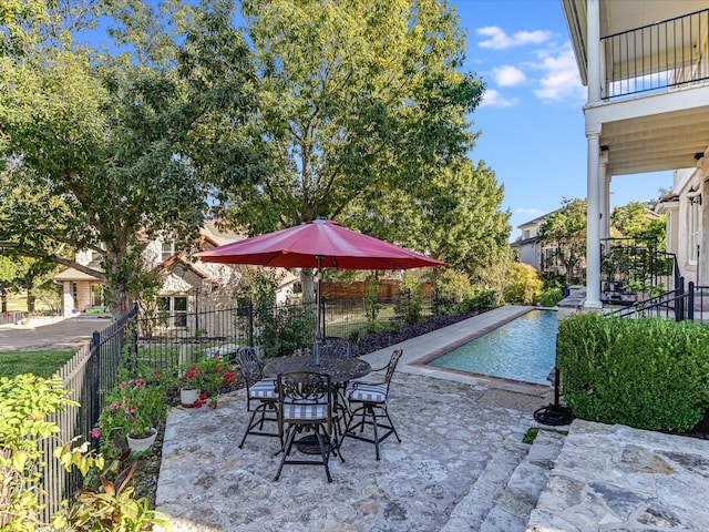 view of swimming pool featuring a patio area