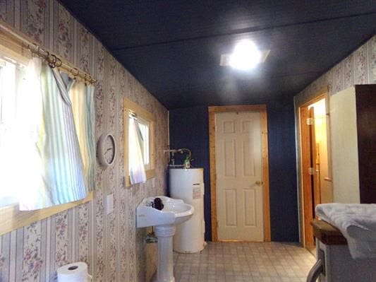 bathroom featuring gas water heater