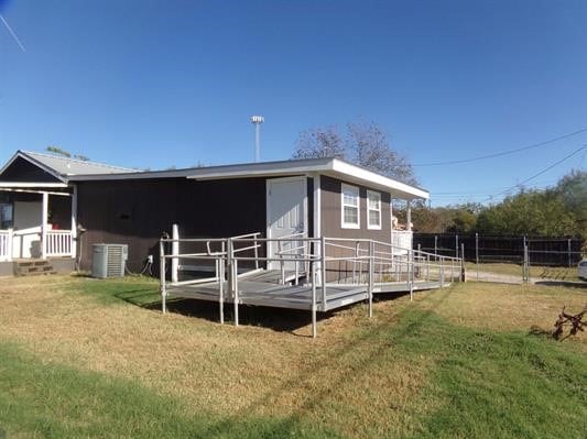 rear view of property featuring central air condition unit