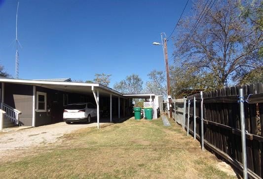 view of yard featuring a carport