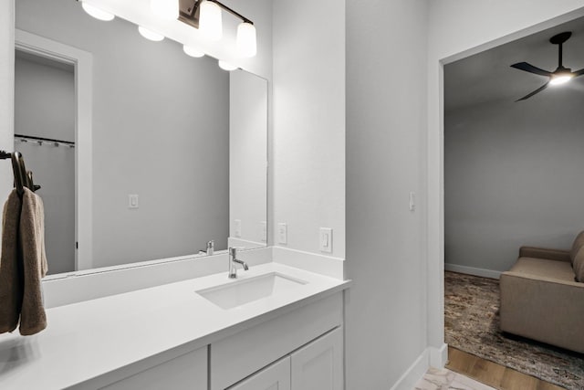 bathroom with ceiling fan and vanity