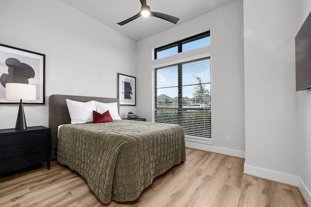 bedroom with ceiling fan and light wood-type flooring