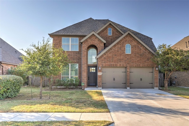 front of property featuring a front lawn and a garage