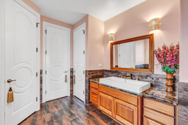 bathroom featuring vanity and decorative backsplash