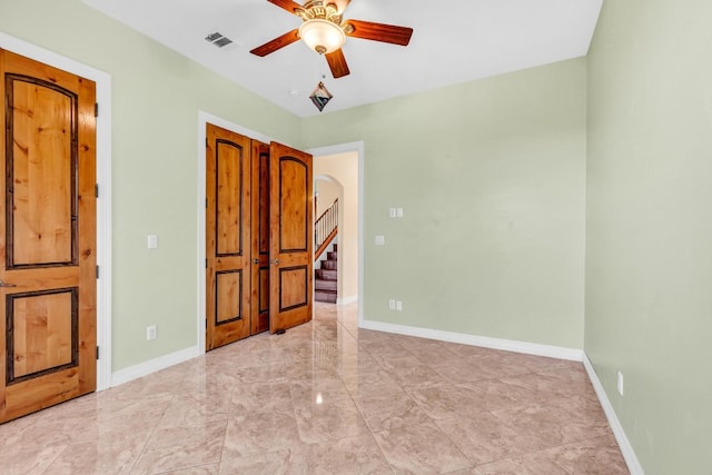 unfurnished bedroom with ceiling fan