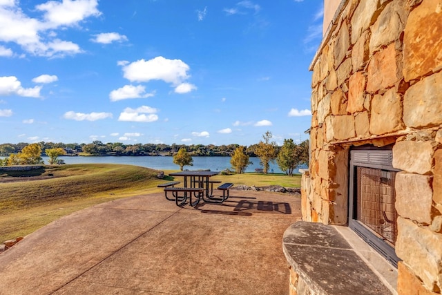 view of patio / terrace with a water view