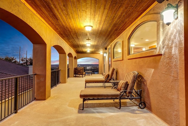 view of patio terrace at dusk