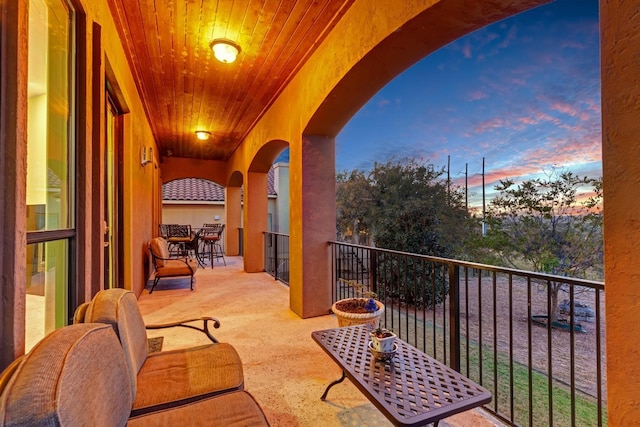 view of balcony at dusk