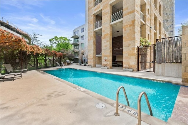 view of swimming pool featuring a patio