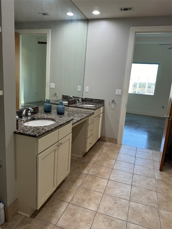 bathroom featuring tile patterned floors and vanity