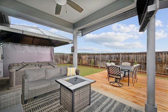 deck featuring a gazebo and an outdoor living space