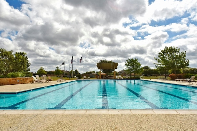 view of swimming pool featuring a patio area