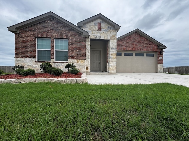 view of front of house with a garage and a front lawn