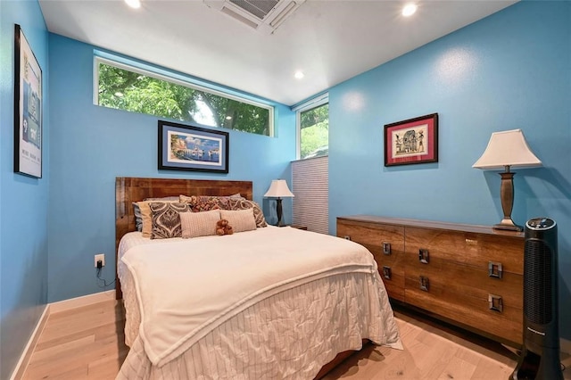 bedroom with light hardwood / wood-style flooring