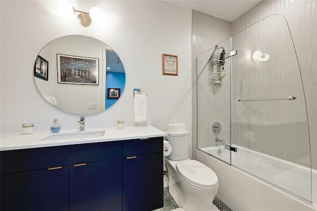 full bathroom with tile patterned flooring, vanity, enclosed tub / shower combo, and toilet