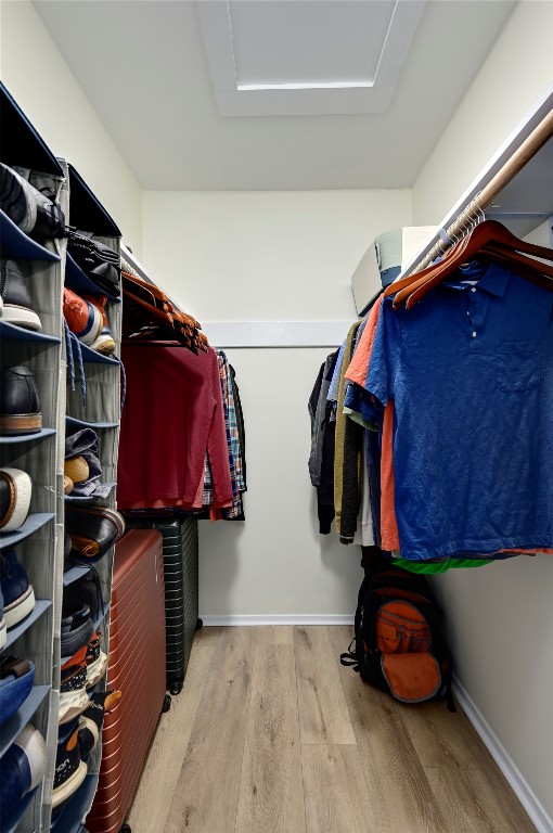 walk in closet featuring light hardwood / wood-style floors