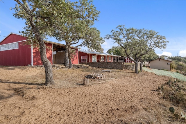 view of front of house with an outbuilding