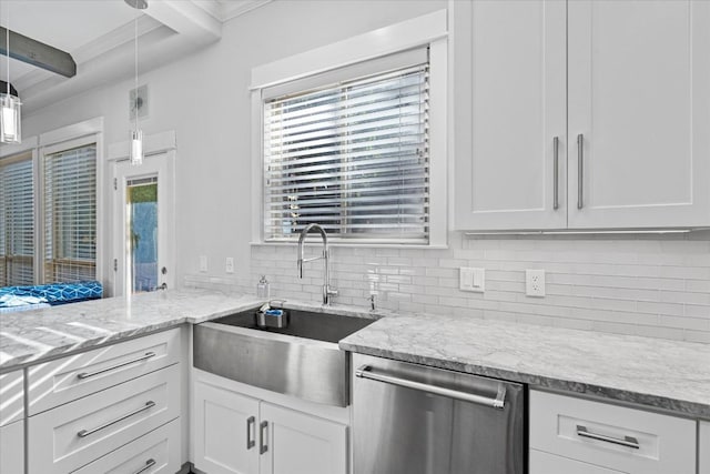 1503 Juliet St, Austin, TX 78704 - kitchen featuring dishwasher, decorative backsplash, white cabinetry, and light stone counters