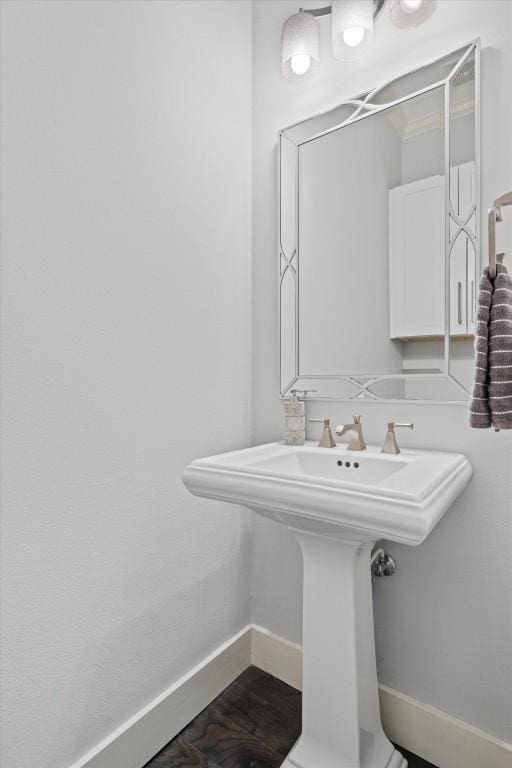 1503 Juliet St, Austin, TX 78704 - bathroom featuring baseboards and a sink