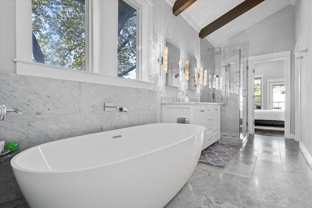 1503 Juliet St, Austin, TX 78704 - full bathroom featuring marble tiled floors, a shower stall, vanity, a freestanding bath, and tile walls