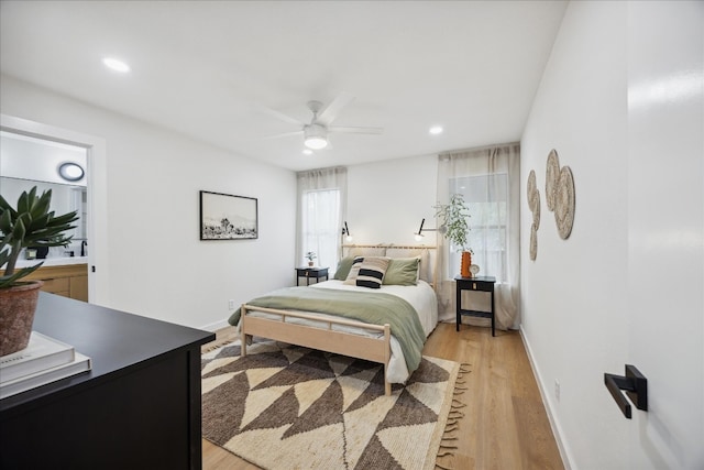 bedroom with light wood-type flooring and ceiling fan