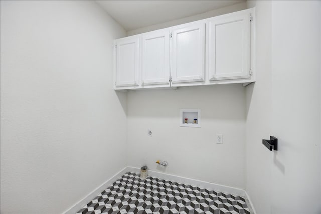 clothes washing area with hookup for an electric dryer, hookup for a gas dryer, cabinets, and hookup for a washing machine