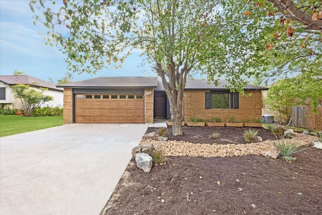 ranch-style house featuring a garage