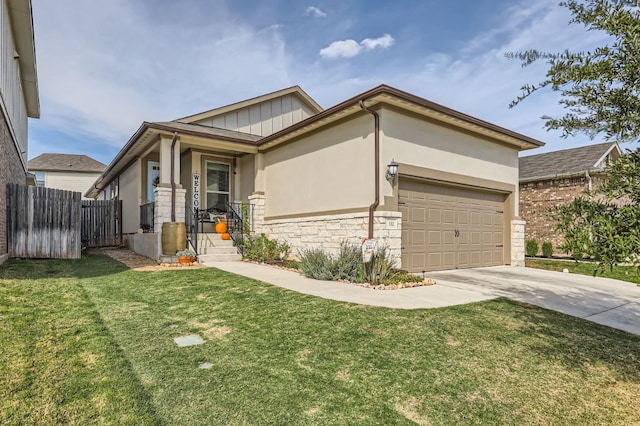 view of front facade with a garage and a front lawn