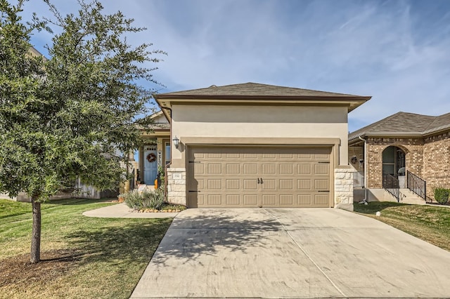 view of front of property with a front lawn and a garage