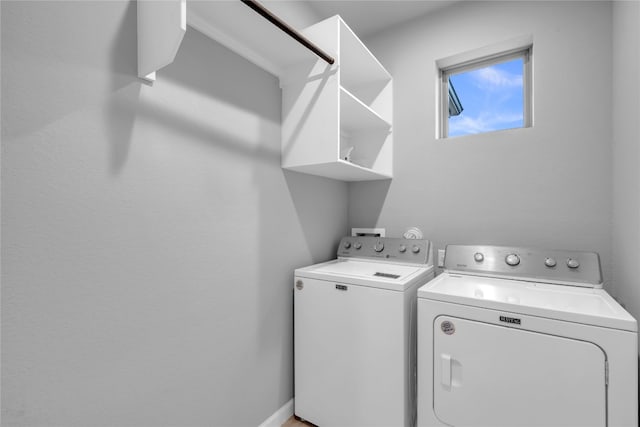 laundry room with washing machine and clothes dryer