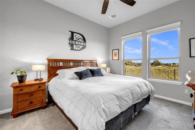 carpeted bedroom featuring ceiling fan