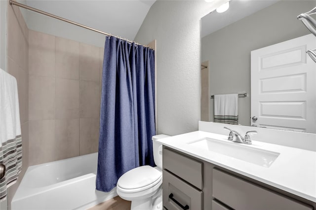 full bathroom featuring shower / bath combo with shower curtain, vanity, toilet, and lofted ceiling