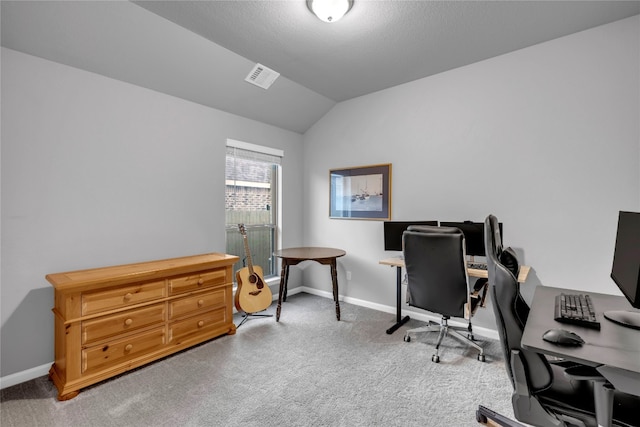 office space with carpet flooring and vaulted ceiling