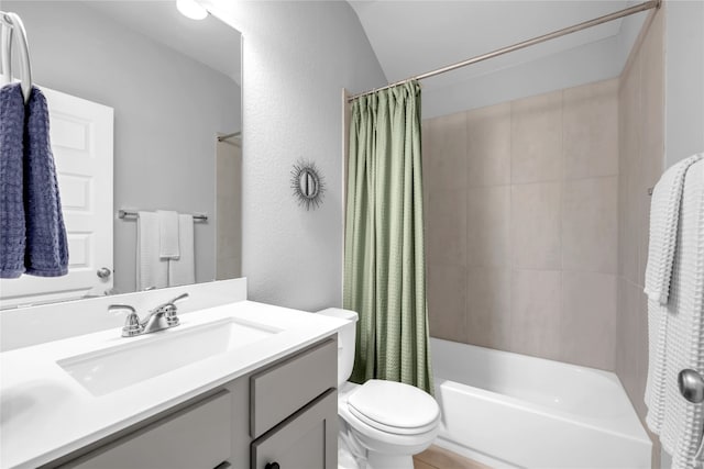 full bathroom with shower / bathtub combination with curtain, vanity, vaulted ceiling, and toilet