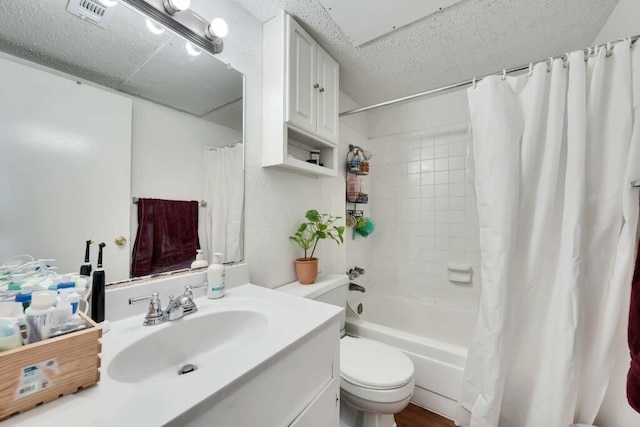 full bathroom with vanity, toilet, and shower / bath combo with shower curtain