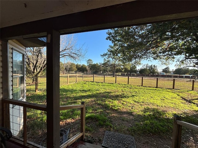 view of yard with a rural view