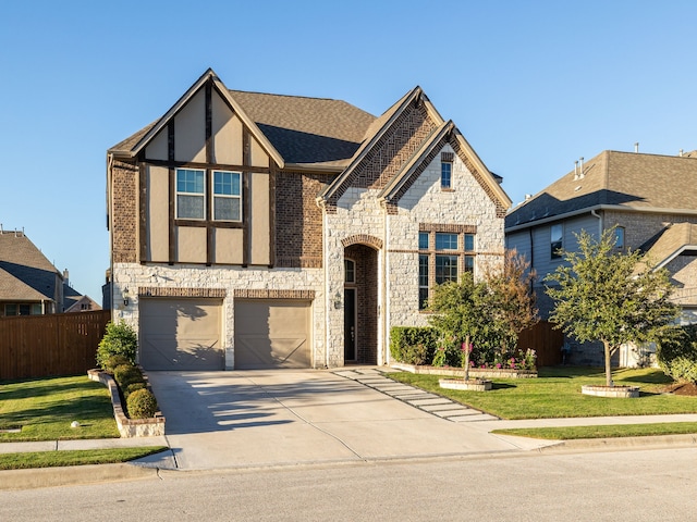 view of front of property featuring a front lawn and a garage