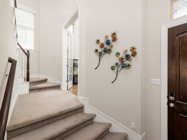 foyer entrance with light hardwood / wood-style flooring