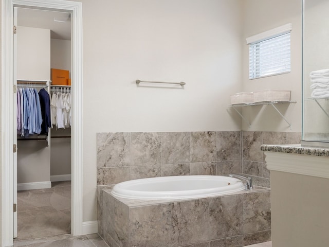 bathroom with tiled bath