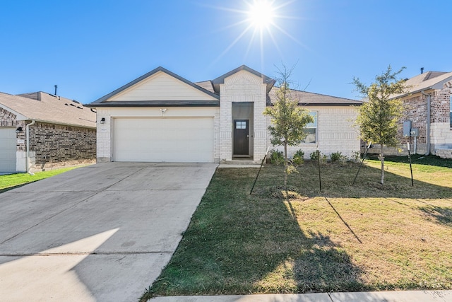 ranch-style house featuring a garage and a front yard