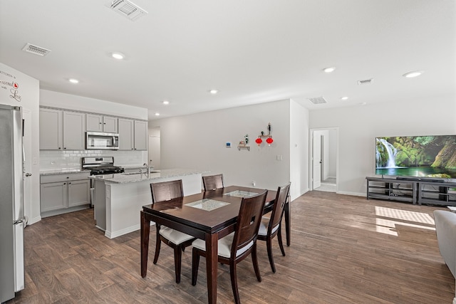 dining room with dark hardwood / wood-style floors